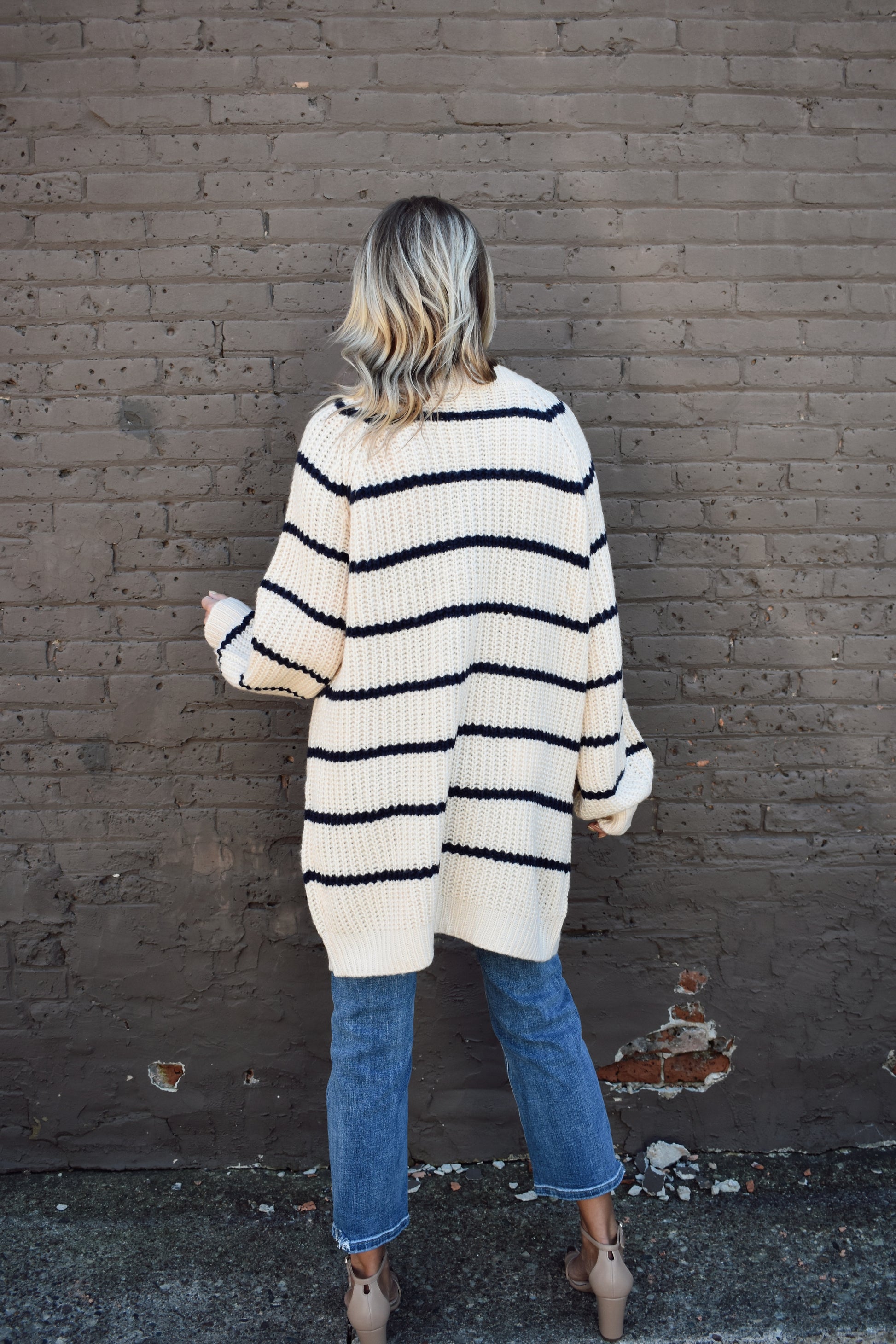 oversized long knit cardigan. cream with navy stripes. button front.