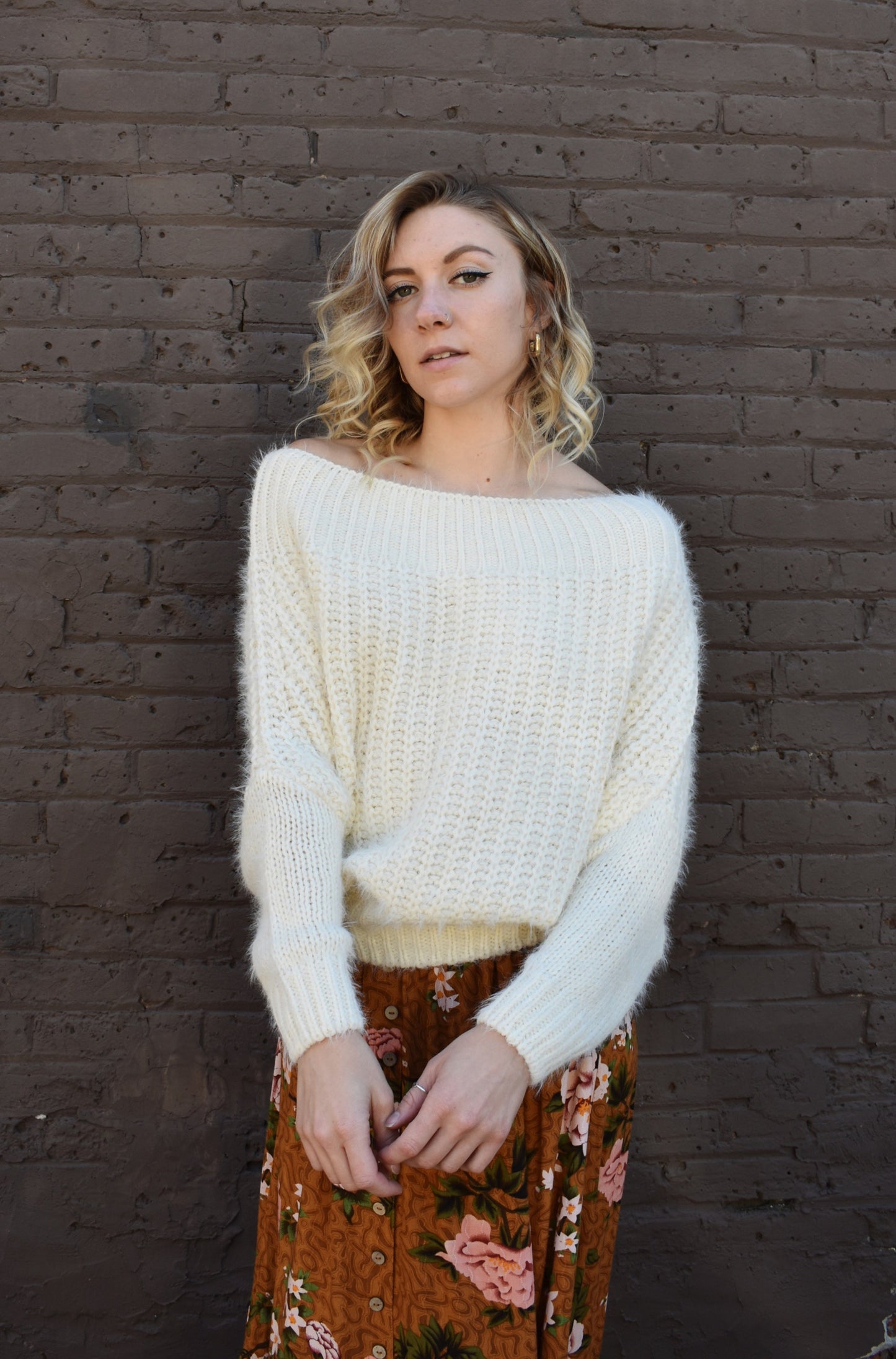 ivory slouchy knitted mohair design sweater with boat neckline that can be situated off the shoulder. full length