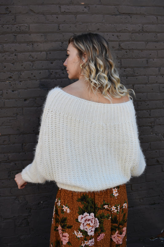 ivory slouchy knitted mohair design sweater with boat neckline that can be situated off the shoulder. full length