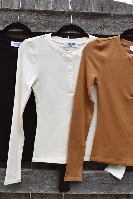 fitted full length long sleeve henley with four buttons on the front crew neck stretchy