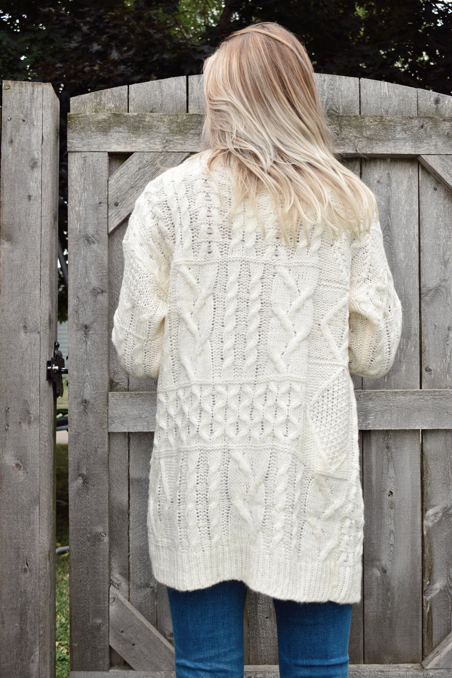 ivory cardigan with mix knit pattern and ribbed cuffs tunic length
