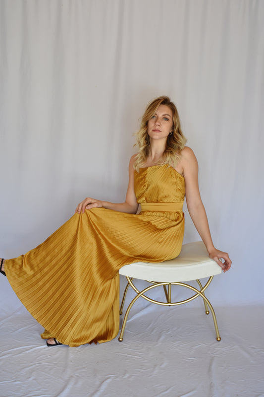 marigold satin pleated extra wide leg jumpsuit with spaghetti straps and band at waist with hidden zipper enclosure on back straight across neckline
