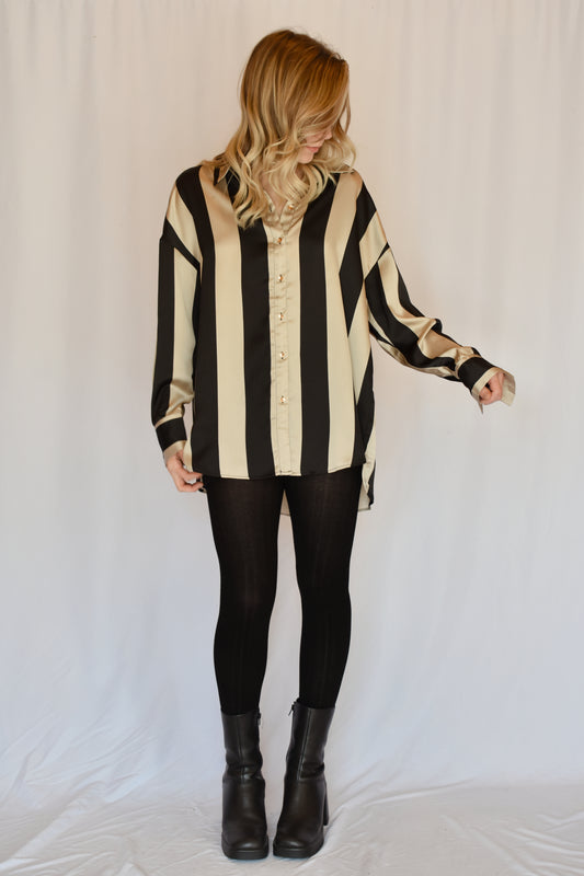 black and light tan striped satin button down slightly oversized button cuffs drop shoulders high low hem