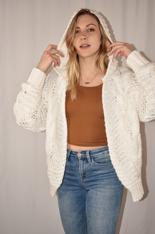 chunky cable knit cardigan in ivory with hood. waist length. 