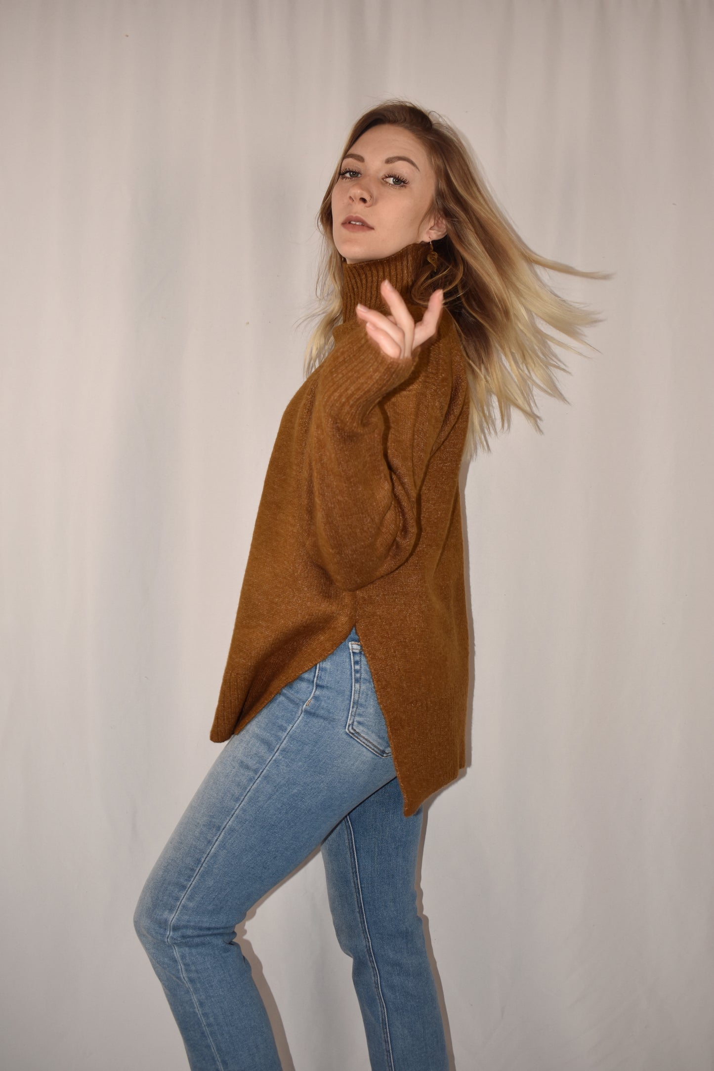boxy high neck sweater with turtleneck that doesn't fold over. full length with side slits.
