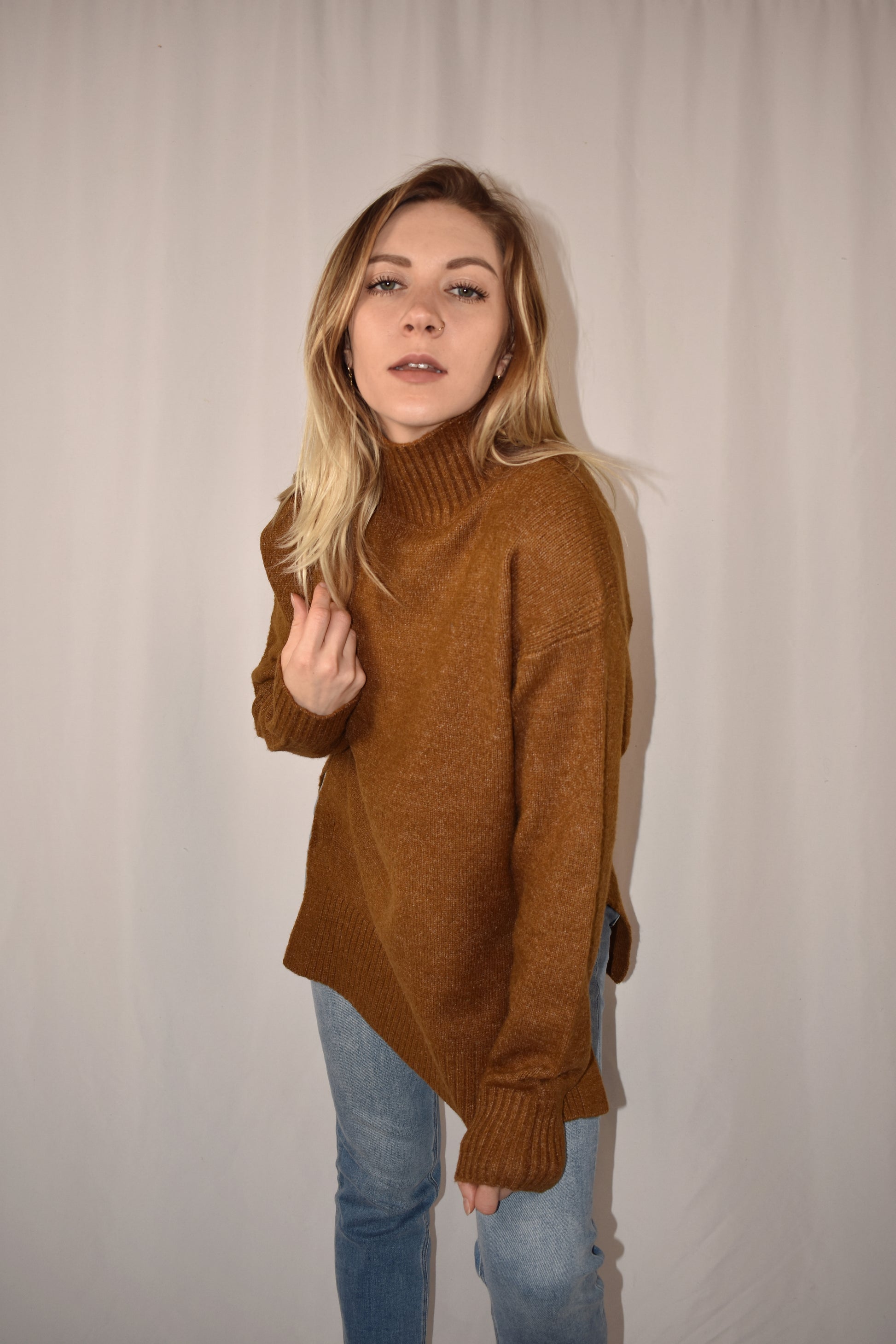 boxy high neck sweater with turtleneck that doesn't fold over. full length with side slits.