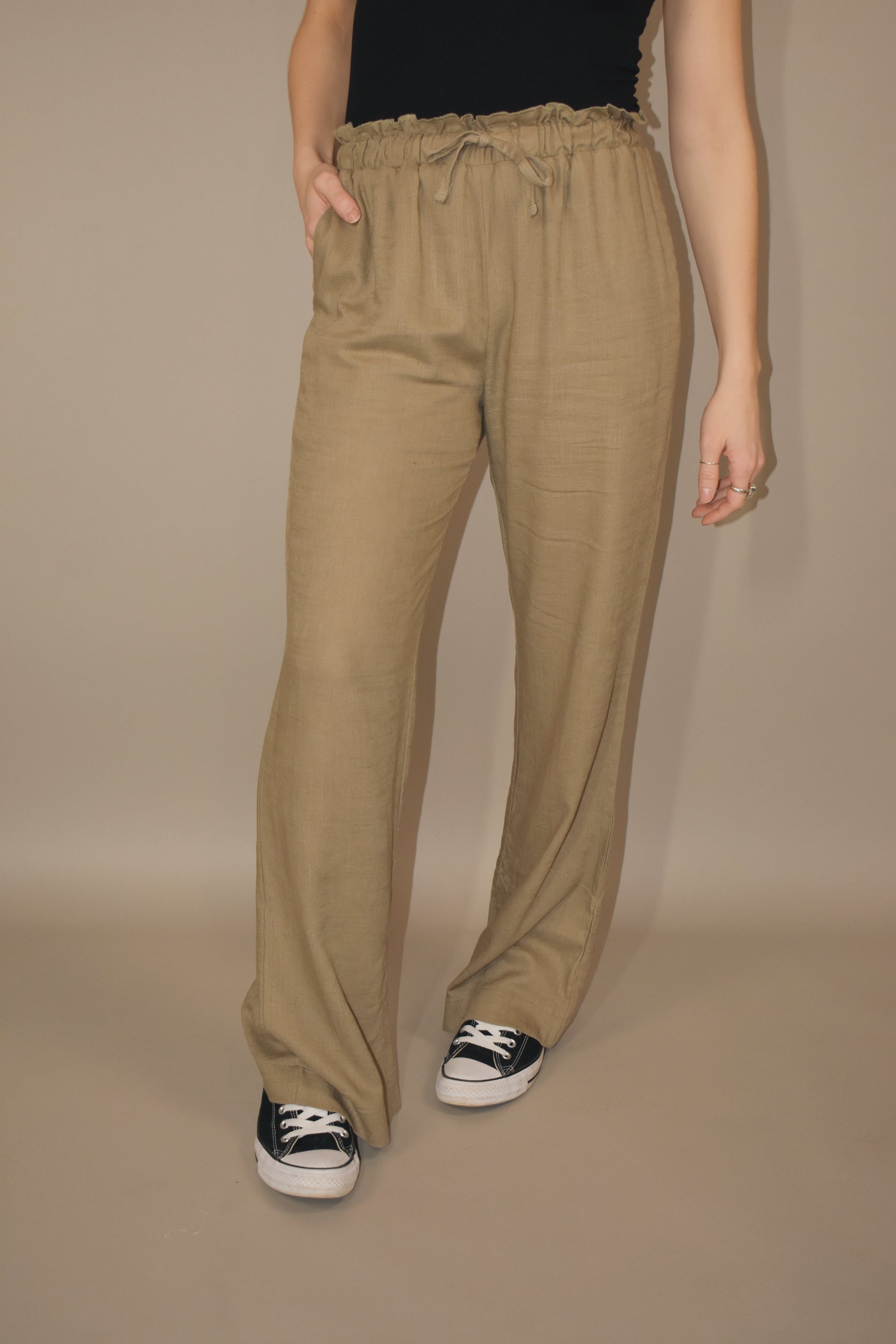straight leg relaxed resort pants with a lettuce top with a drawstring, side pockets, shorts lining on the inside.