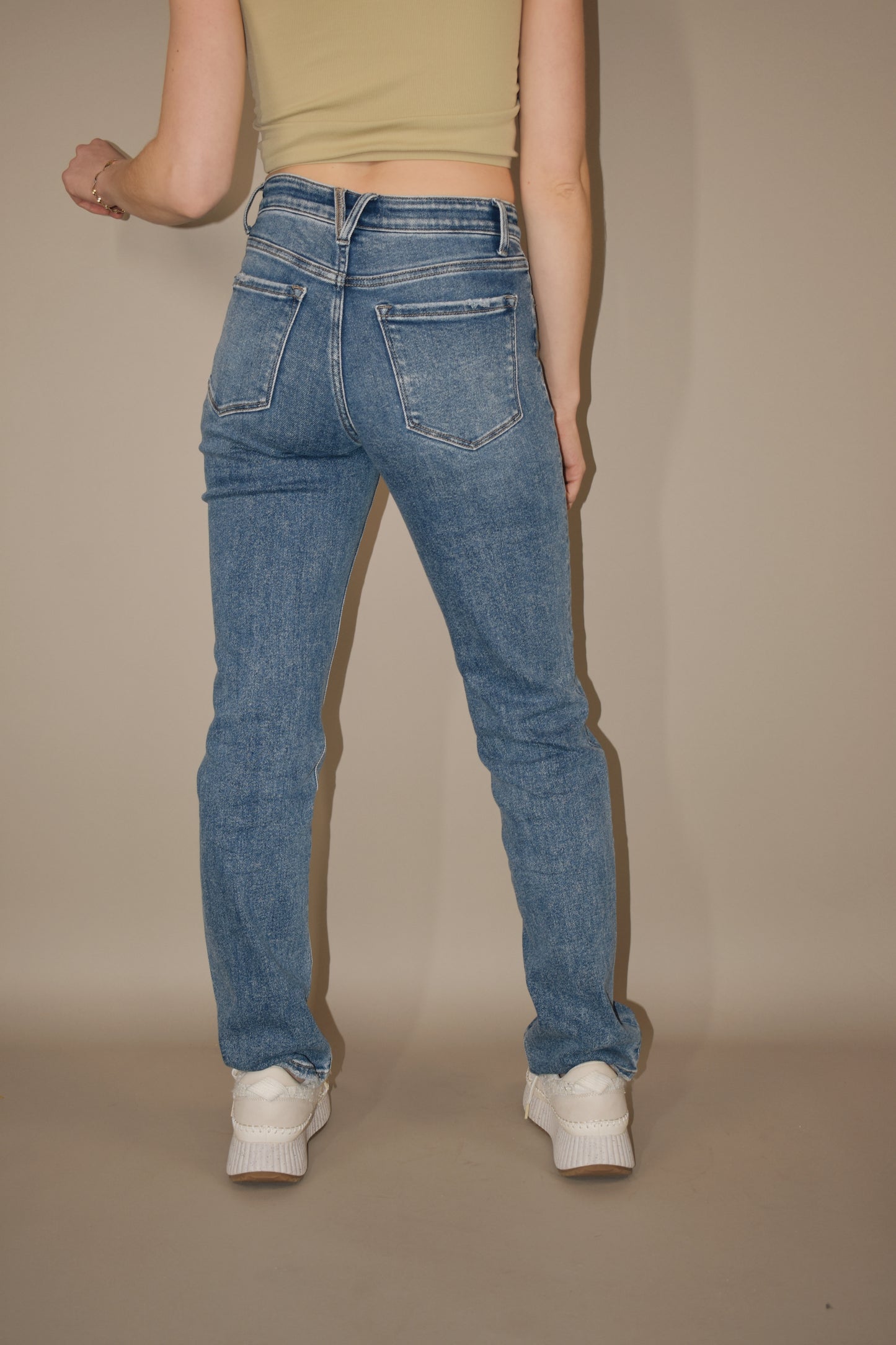 full length stretch denim high rise medium wash jeans. straight leg. no holes. 