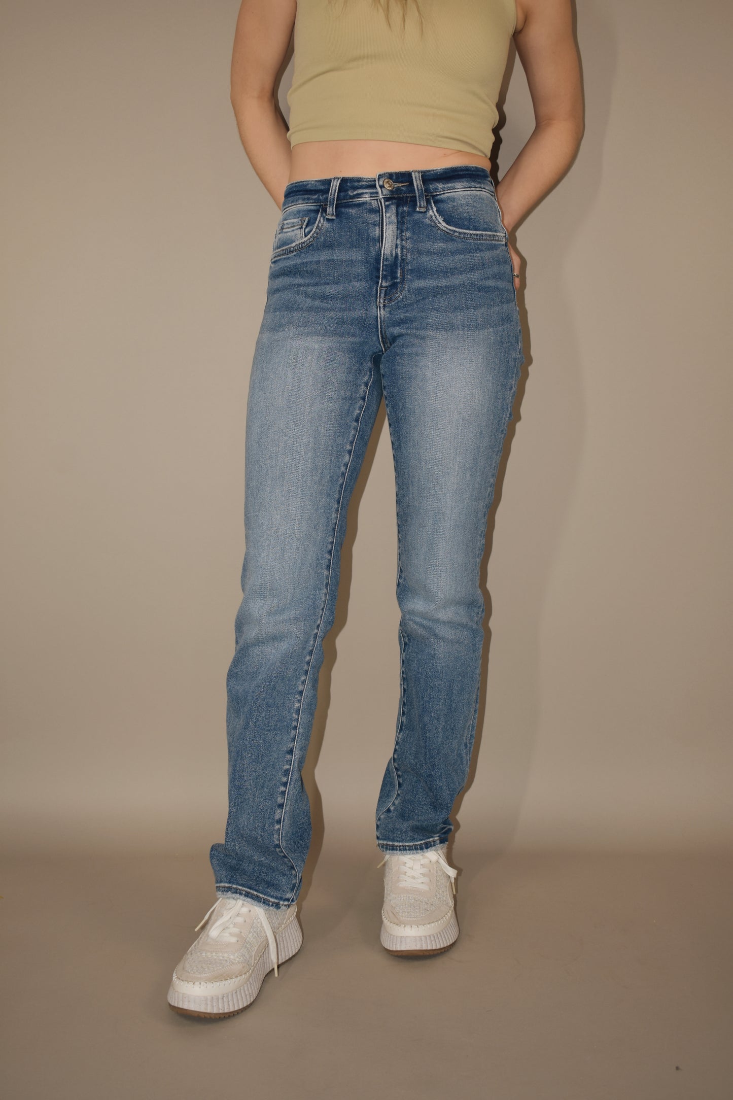 full length stretch denim high rise medium wash jeans. straight leg. no holes. 