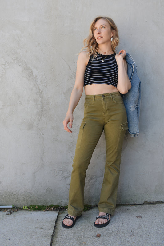 straight legged olive colored stretch denim with side cargo pockets flap enclosure front and back pockets no holes