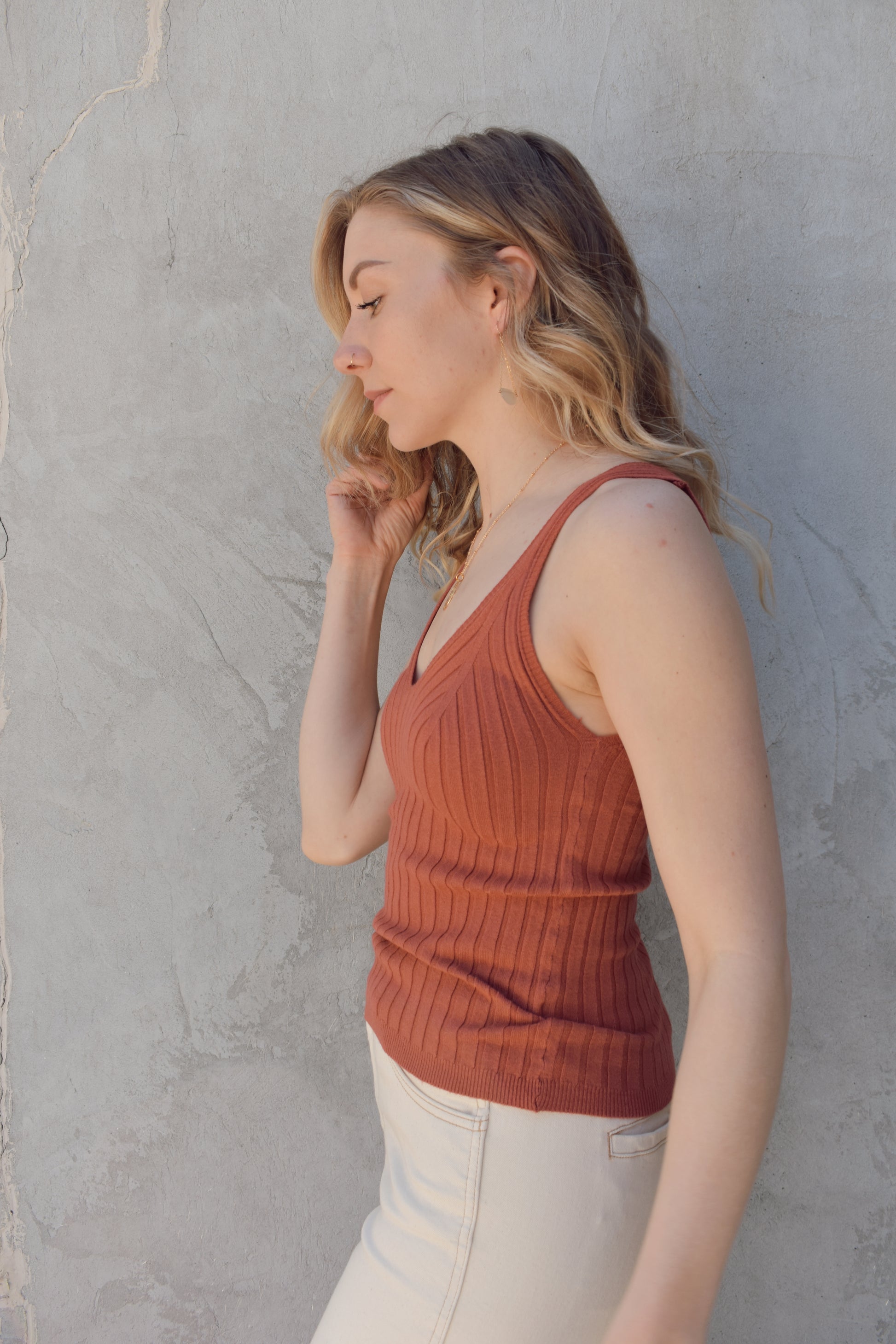 v neck sweater tank with wide ribbed texture. lightweight. stretchy. full length. fitted.