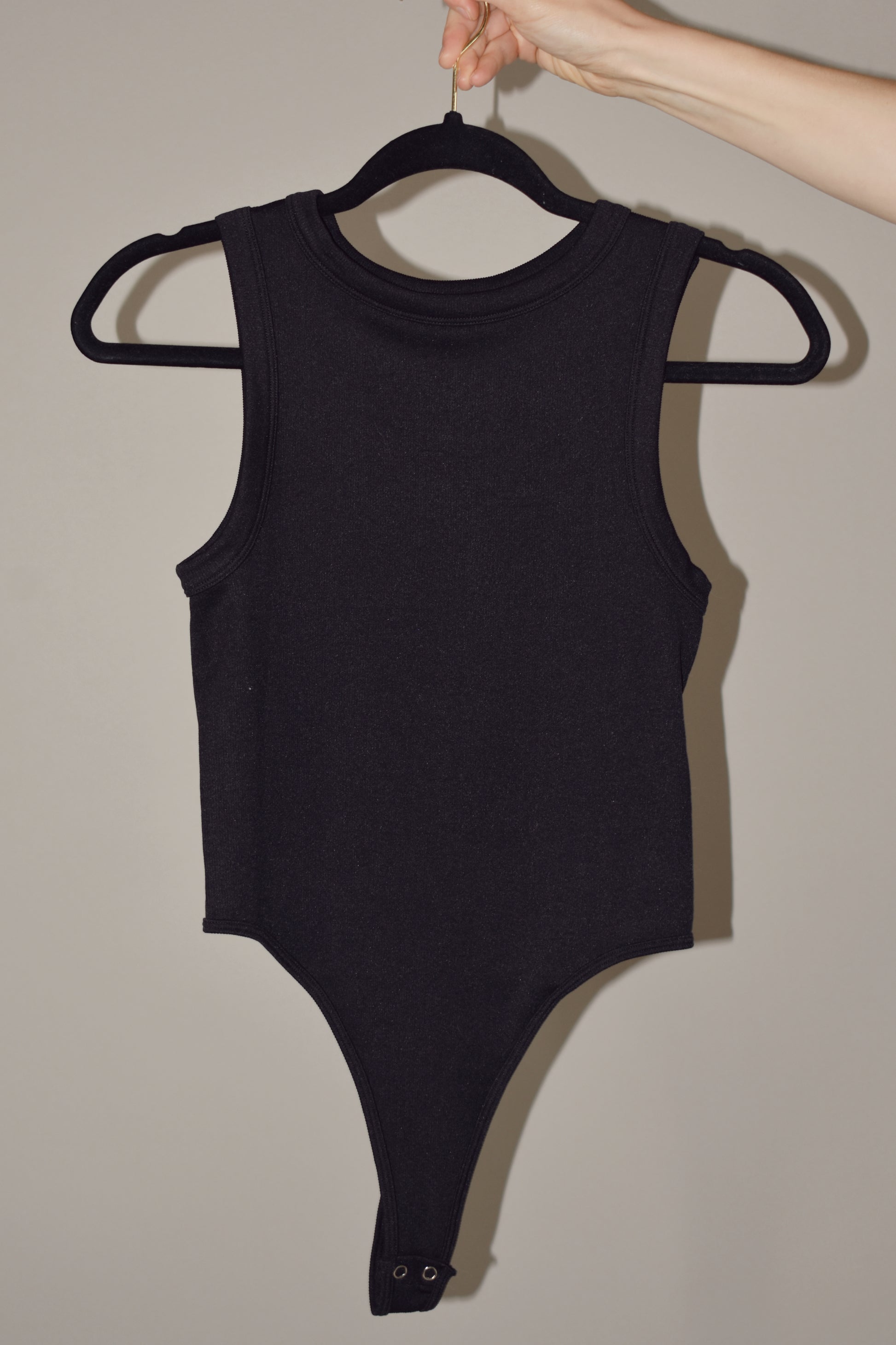 ribbed tank bodysuit, high crew neck, stretchy, two snap enclosure.