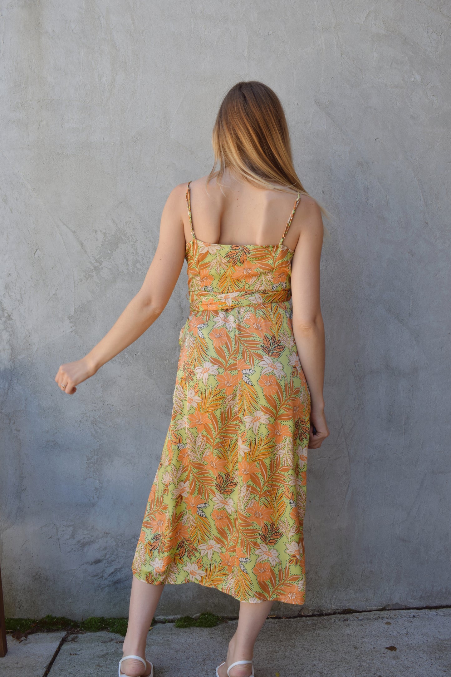 satin spaghetti strap (adjustable) midi wrap dress with light green background and floral/ botanical print in peach, rust, ivory. wedding guest attire.