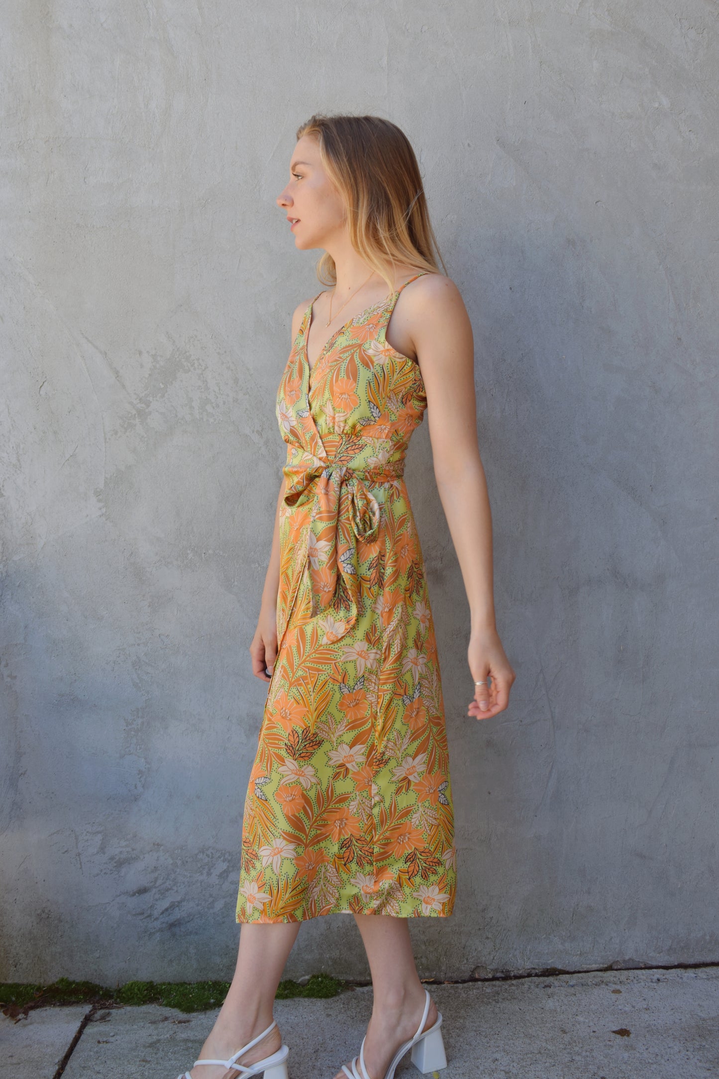 satin spaghetti strap (adjustable) midi wrap dress with light green background and floral/ botanical print in peach, rust, ivory. wedding guest attire.