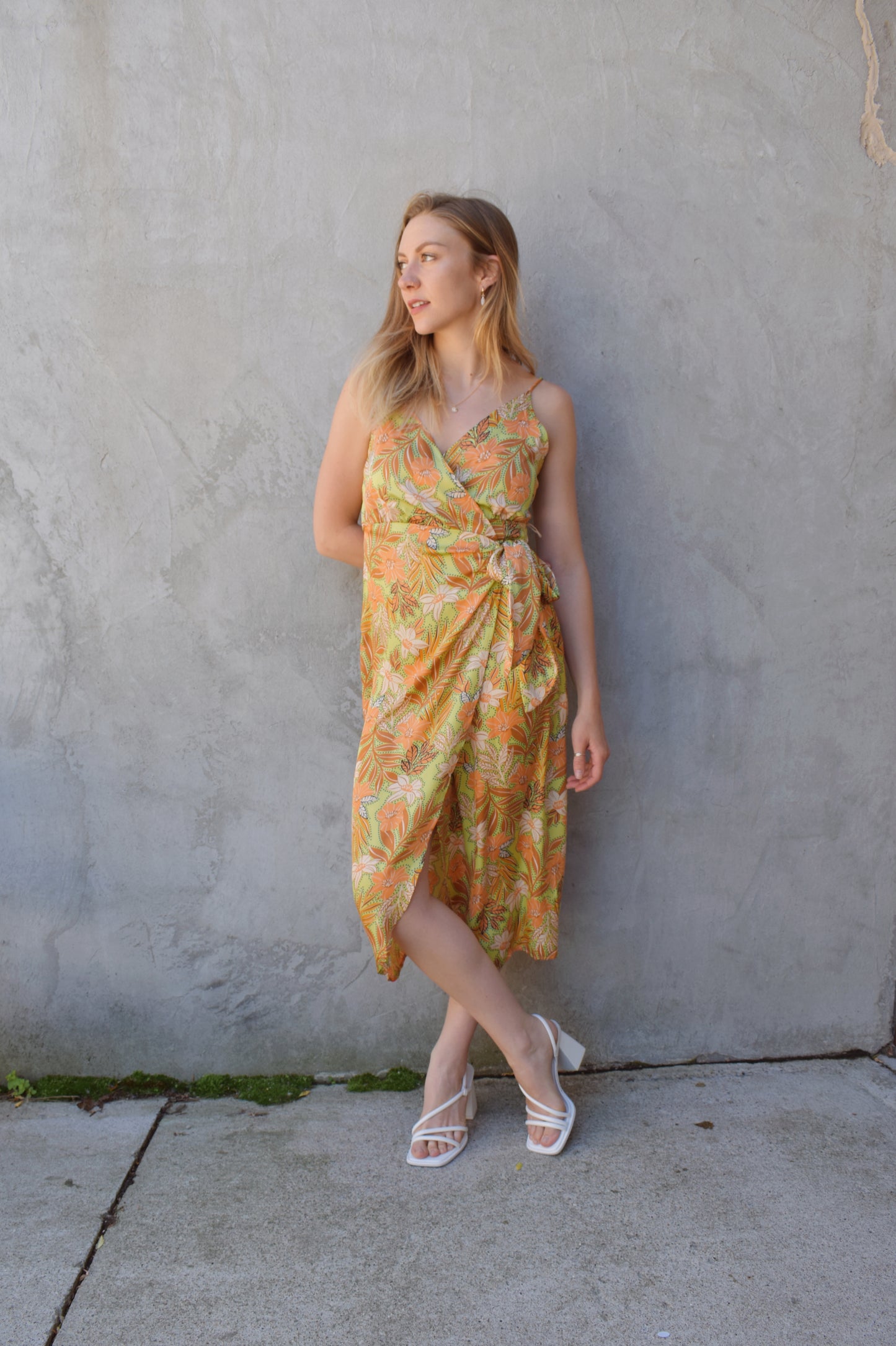 satin spaghetti strap (adjustable) midi wrap dress with light green background and floral/ botanical print in peach, rust, ivory. wedding guest attire.