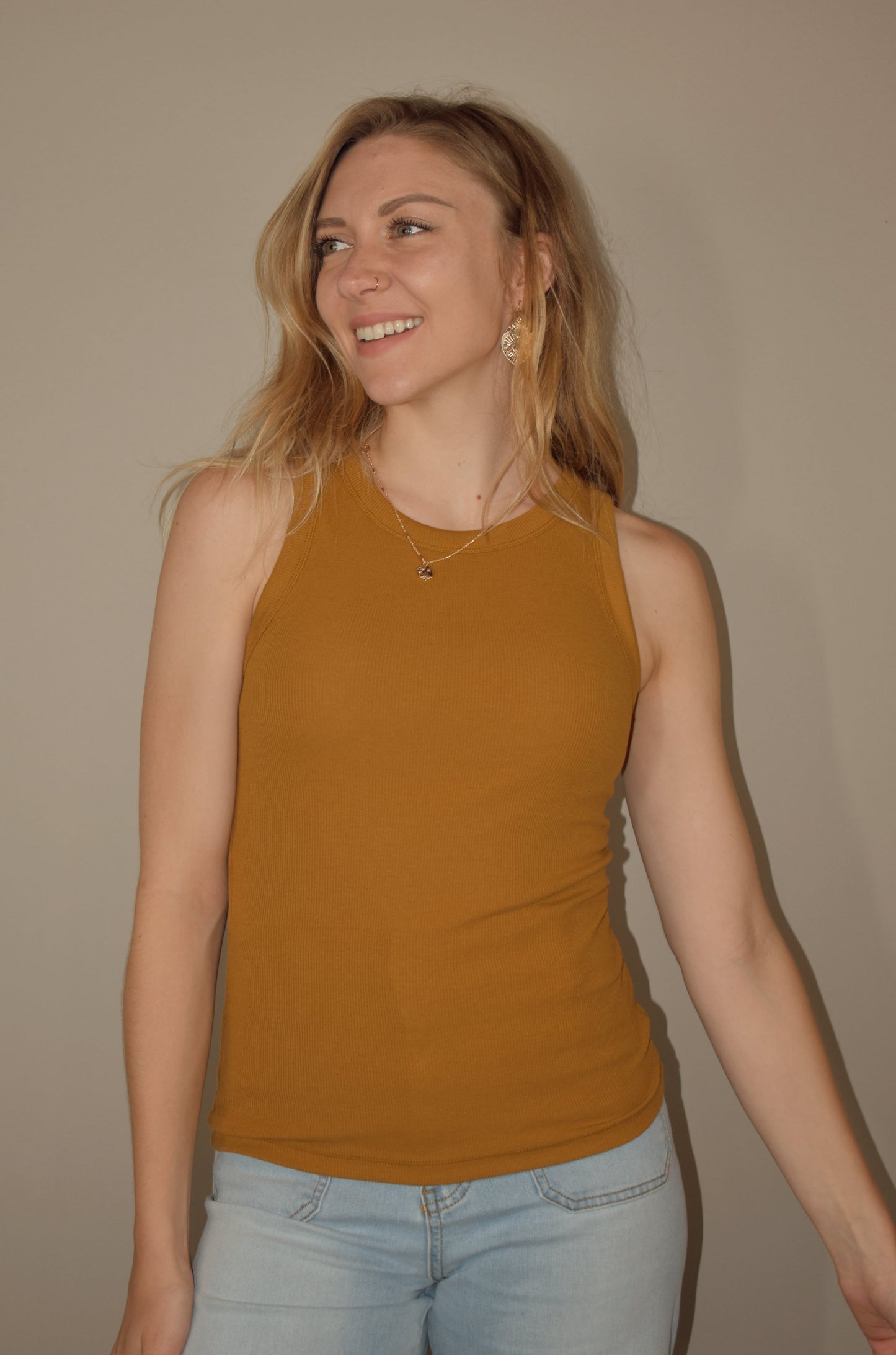 full length fitted tank with crew neck. stretchy and soft yet durable material. 