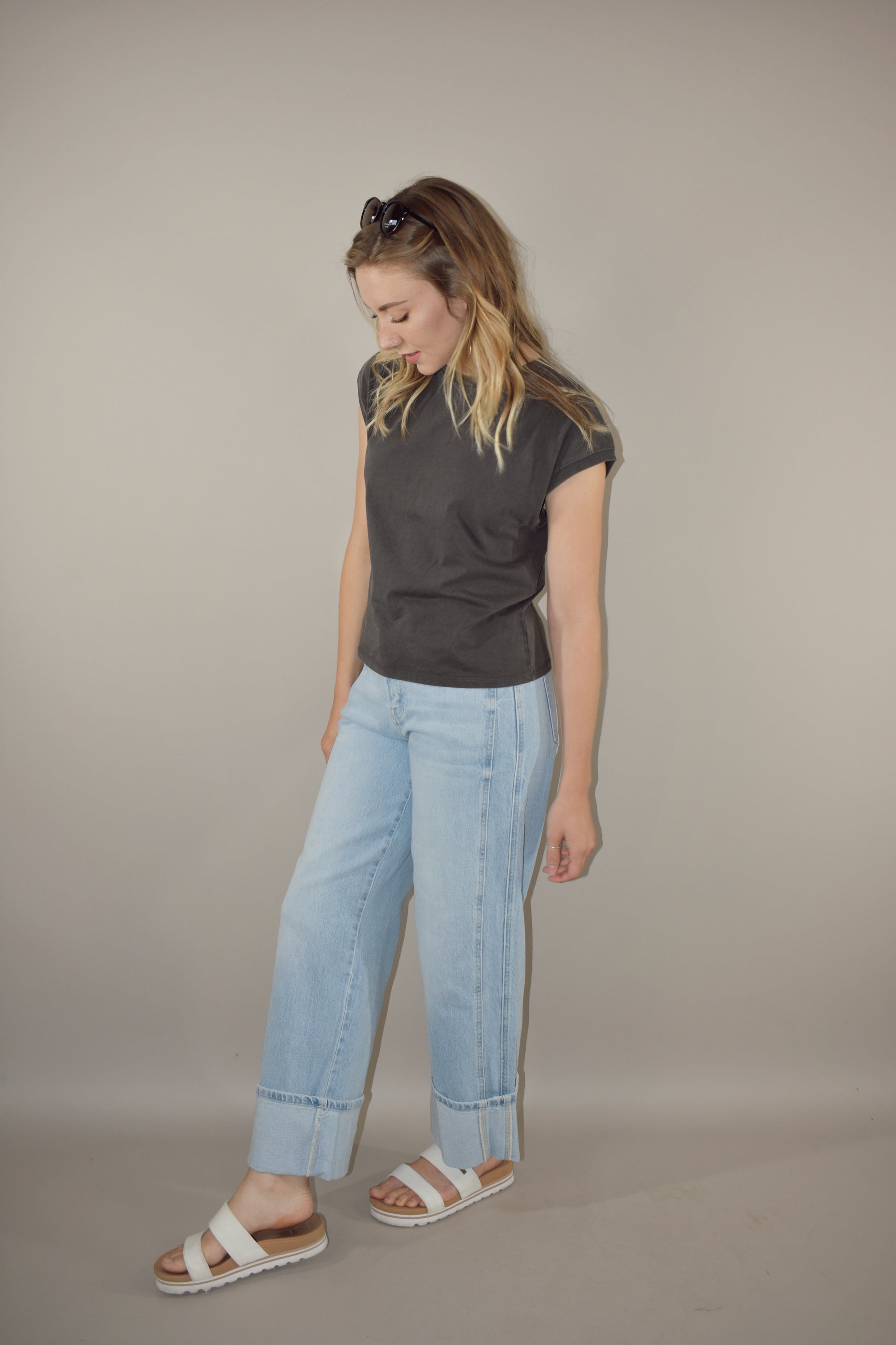 light wash wide leg jeans with large cuff at the hem. no holes or distress marks. double pocket feature in front. stretch denim. has beltloops and back pockets and a zip and button enclosure. high rise. 