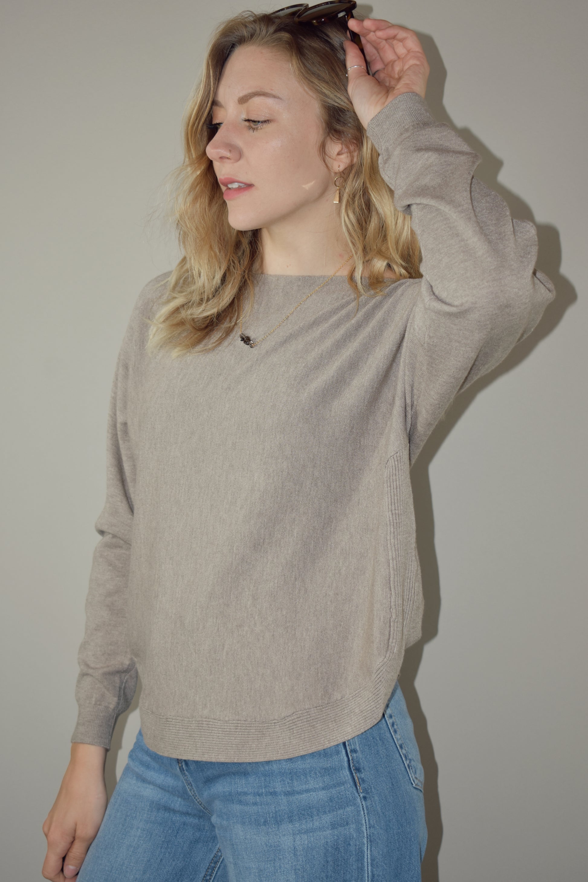 boat neck style pullover sweater with scooped hem and super soft fabric