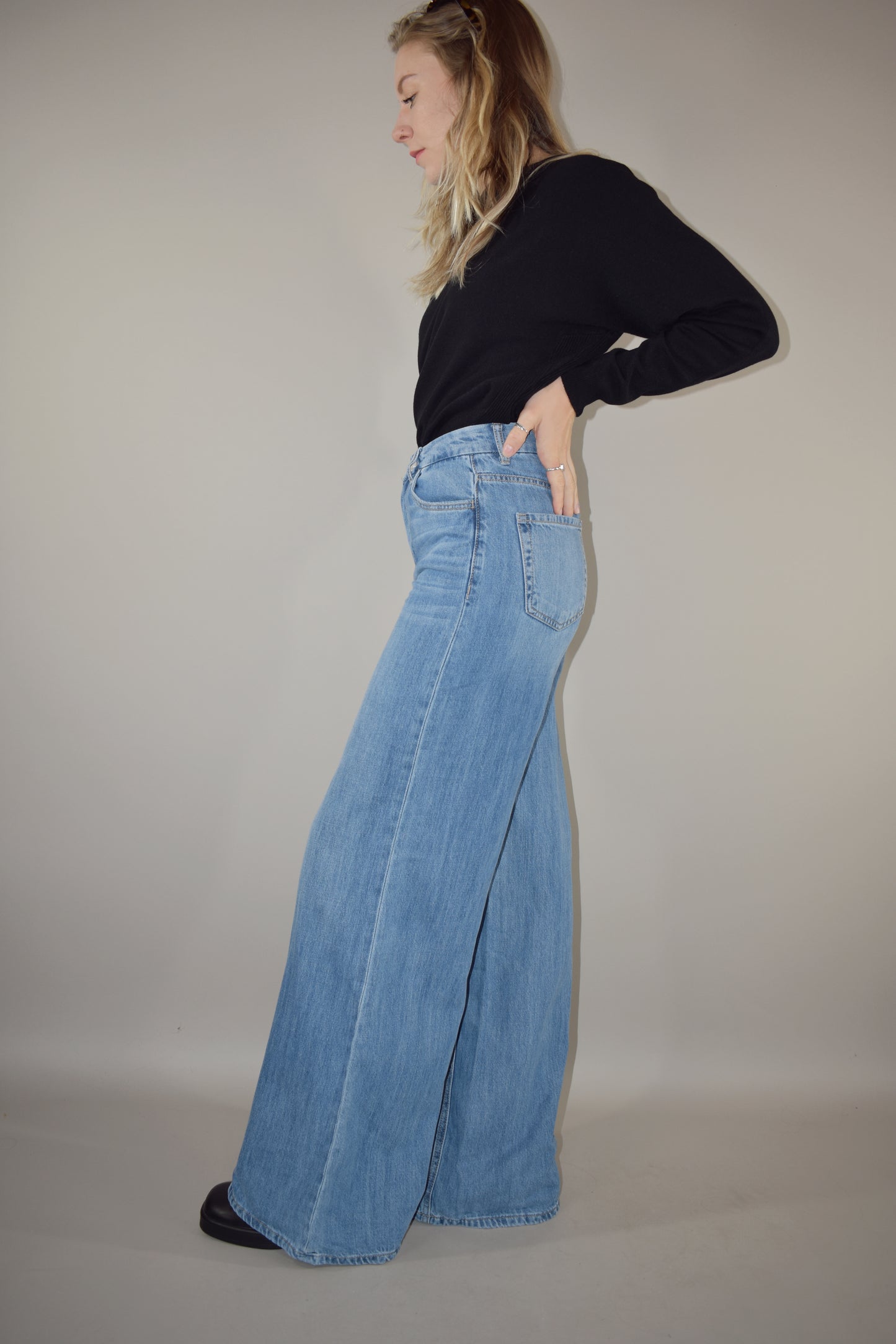 ultra wide high waisted light wash jeans no distressing or holes full length slightly long  