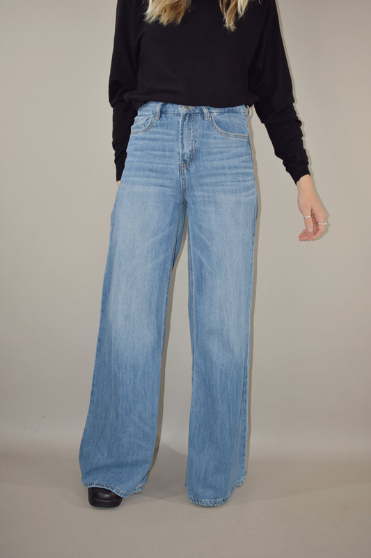 ultra wide high waisted light wash jeans no distressing or holes full length slightly long  