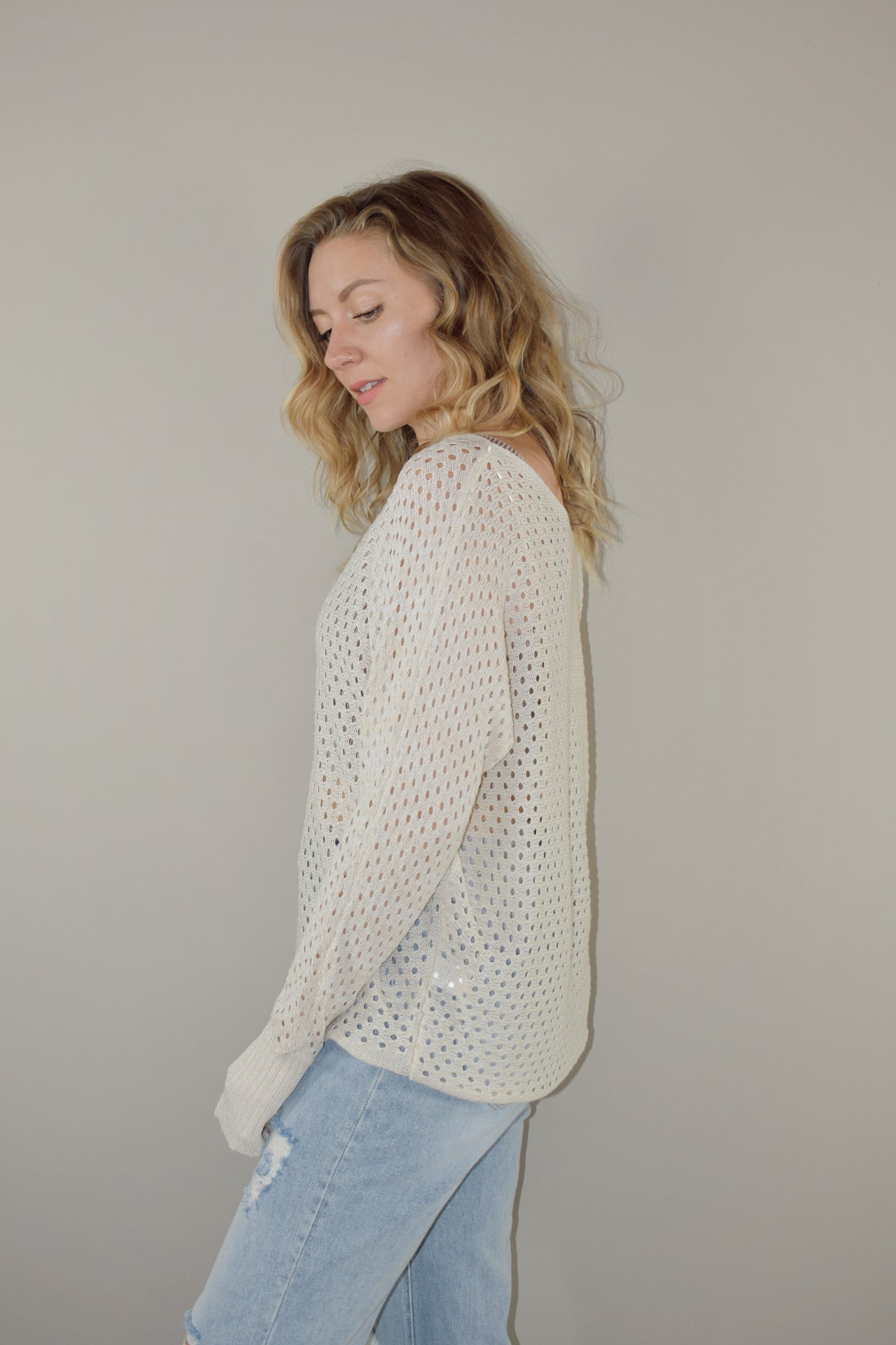 full length long sleeve eyelet lightweight knit sweater with ribbed cuffs and a scoop neck. slouchy style 