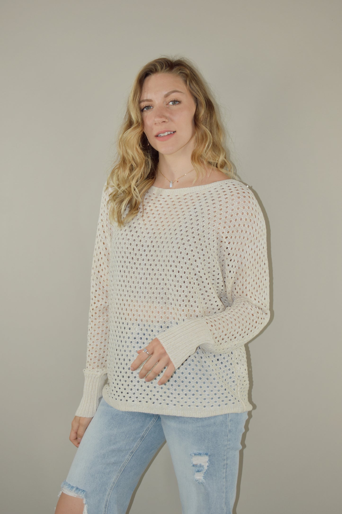 full length long sleeve eyelet lightweight knit sweater with ribbed cuffs and a scoop neck. slouchy style 