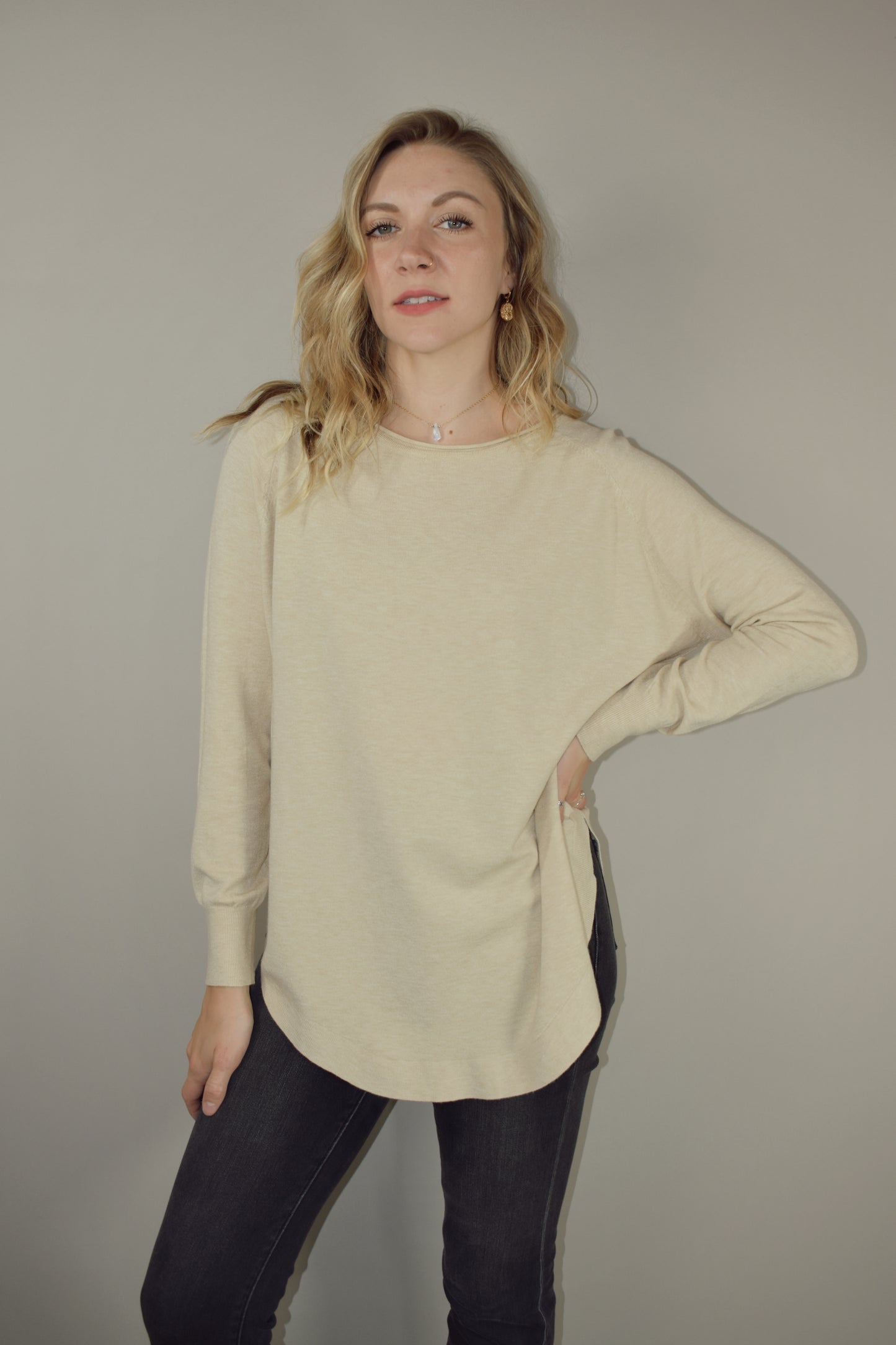 Long boat/crew neck tunic sweater with tight cuffs and scooped hem that comes up on the sides super soft material 