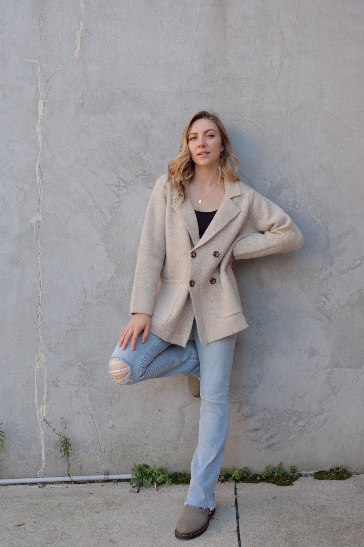 longer sweater coat style cardigan double breasted with patch pockets. brown buttons. slightly oversized.