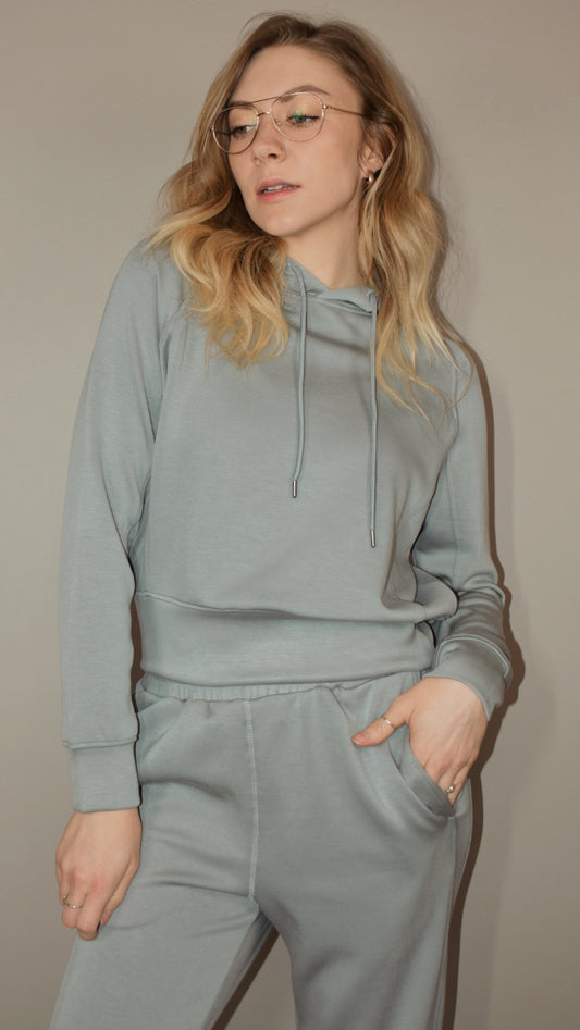 crazy soft hoodie with drawstrings with gold tips and its between cropped and full length