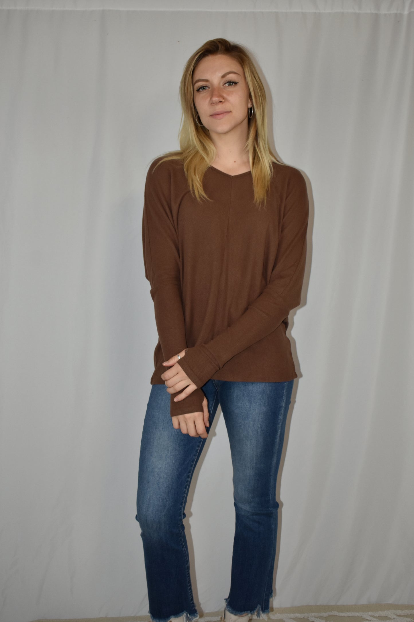 Brown ribbed long sleeve full length stretchy knit top with super soft fabric, dolman sleeves, thumb holes, and a v neck.
