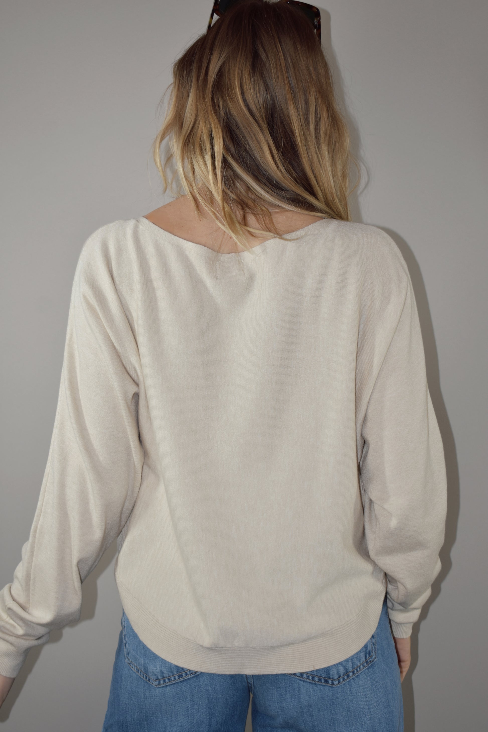 boat neck style pullover sweater with scooped hem and super soft fabric