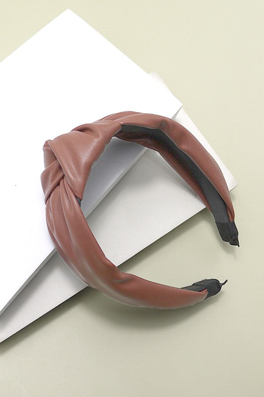 brown faux leather headband with a soft fit and a knot detail