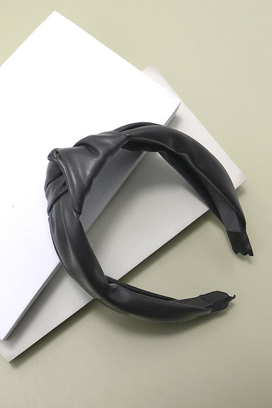 black faux leather headband with a soft fit and a knot detail