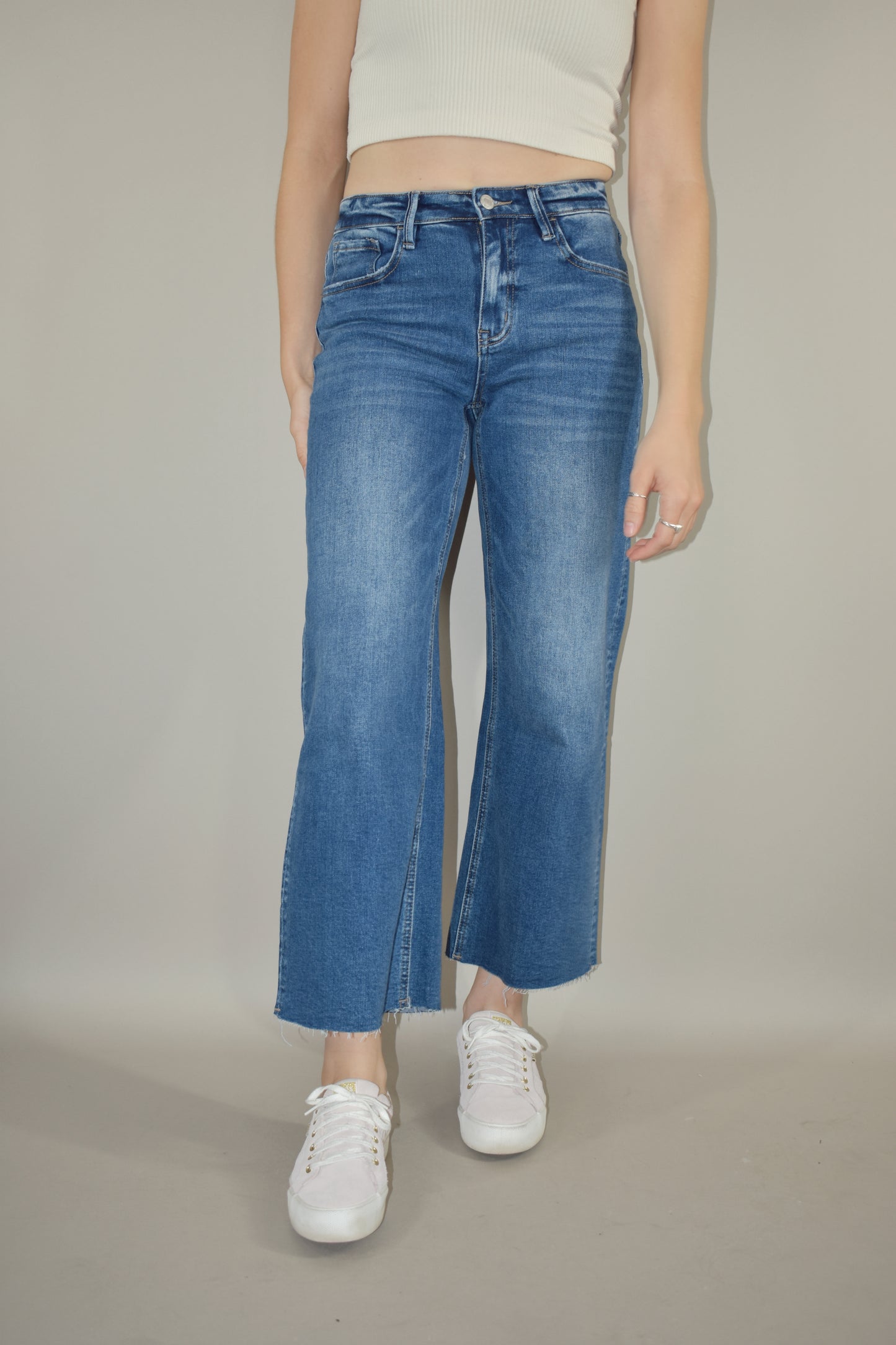 high rise wide leg cropped medium wash stretch denim jeans no holes raw hem