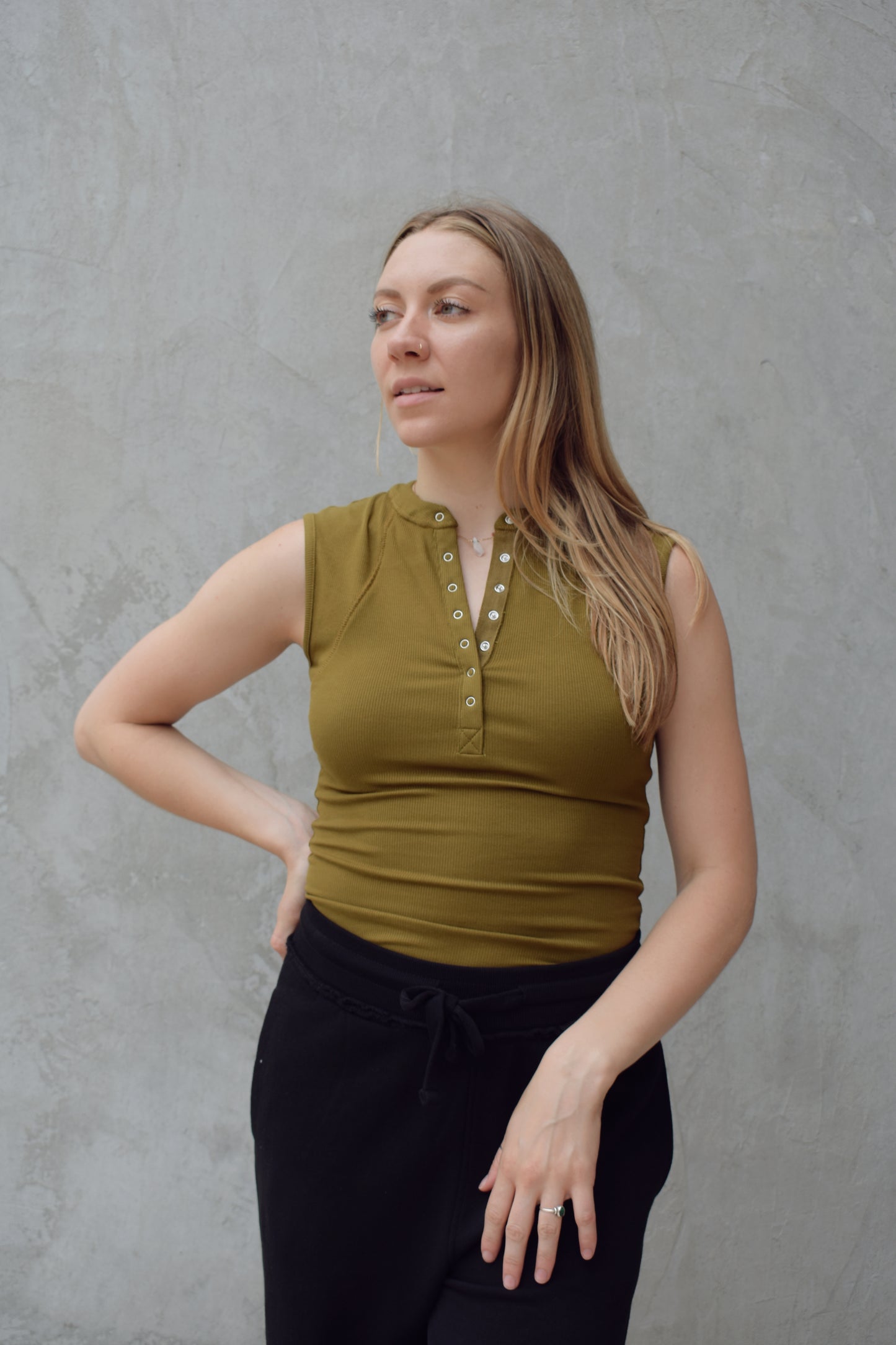 super stretch henley tank top full length with snaps and has exposed seams athleisure fitted
