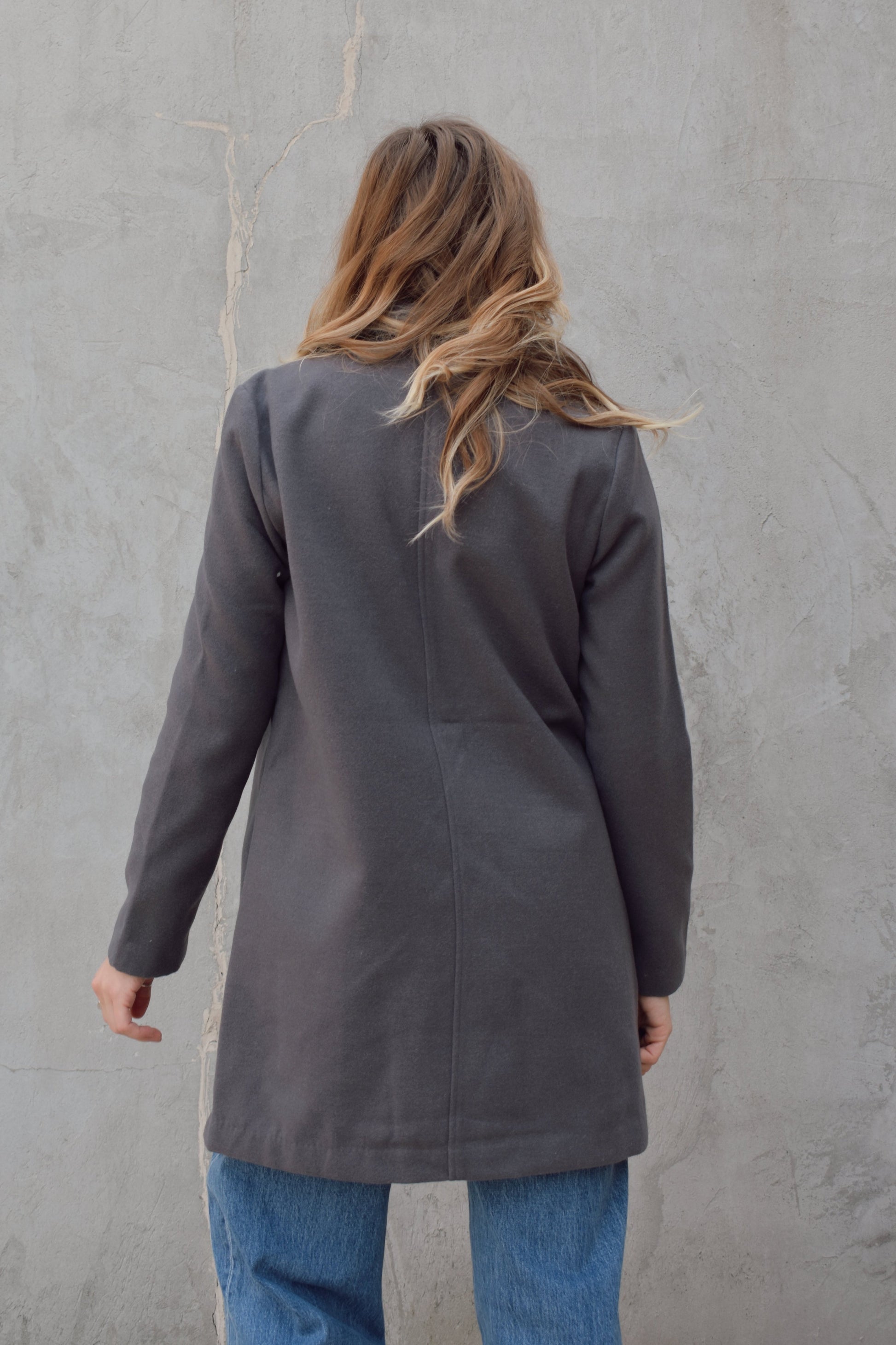 single button over coat peacoat thick felt fabric - fitted style hits mid thigh, side pockets, notched collar.