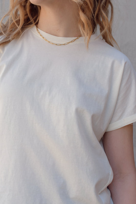 full length relaxed fit crew neck tee with slight cuff and super soft cotton fabric slight high low hem and seam detail down the middle on the back
