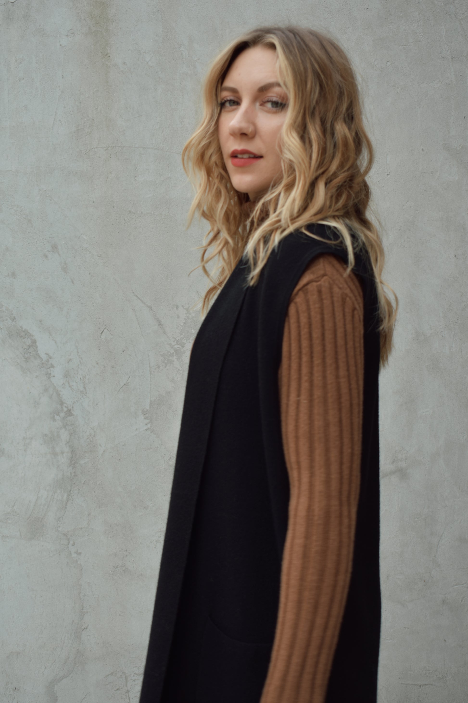 longline cardigan vest with shall collar and front patch pockets. side slits