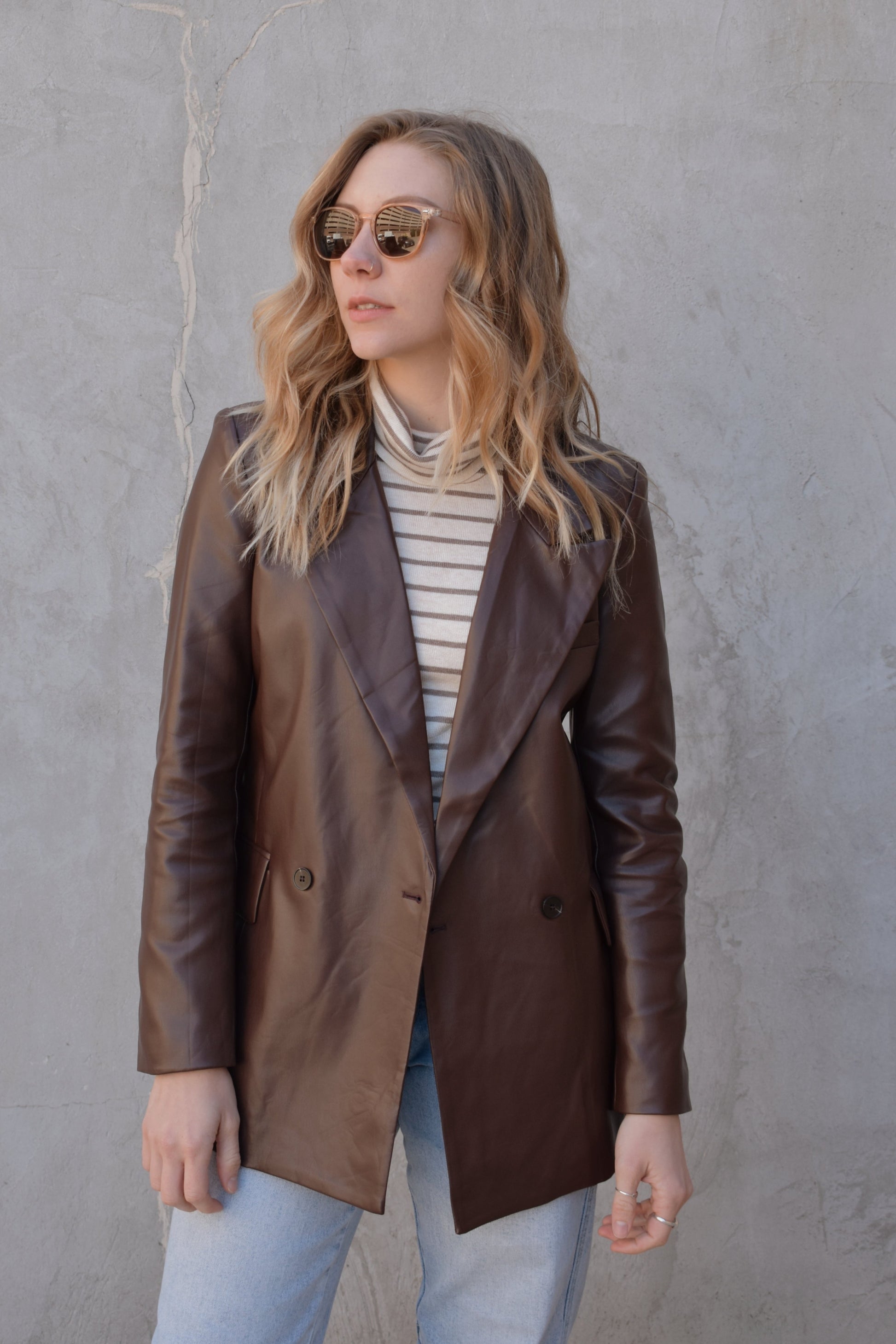 brown faux leather blazer with front flap pockets and front lapel hits at upper thigh split in back hem - fitted