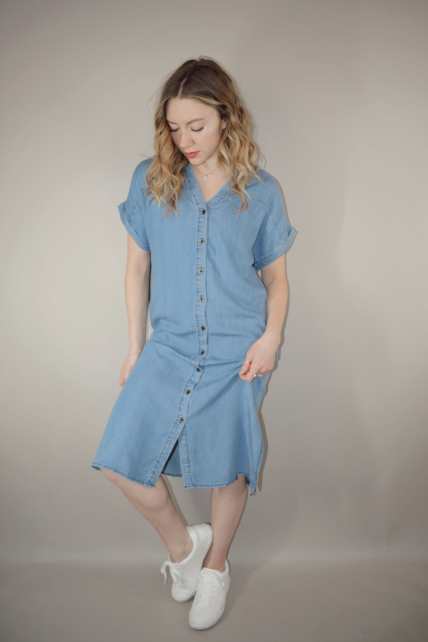 Tencel medium wash denim button down collared t shirt midi dress with side slits, side pockets, cuffed short sleeves