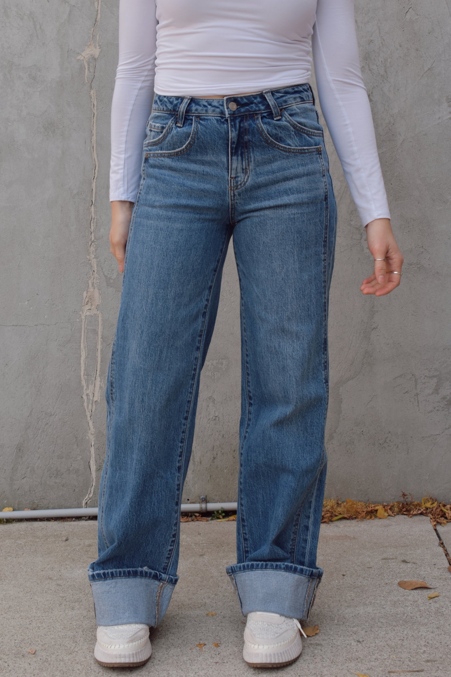 Long wide leg double panel double front pocket jeans with wide cuff at hem that is able to be uncuffed too. no distressing or holes, waistband is a little more rigid but denim is stretchy. zip and button enclosure, has beltloops 