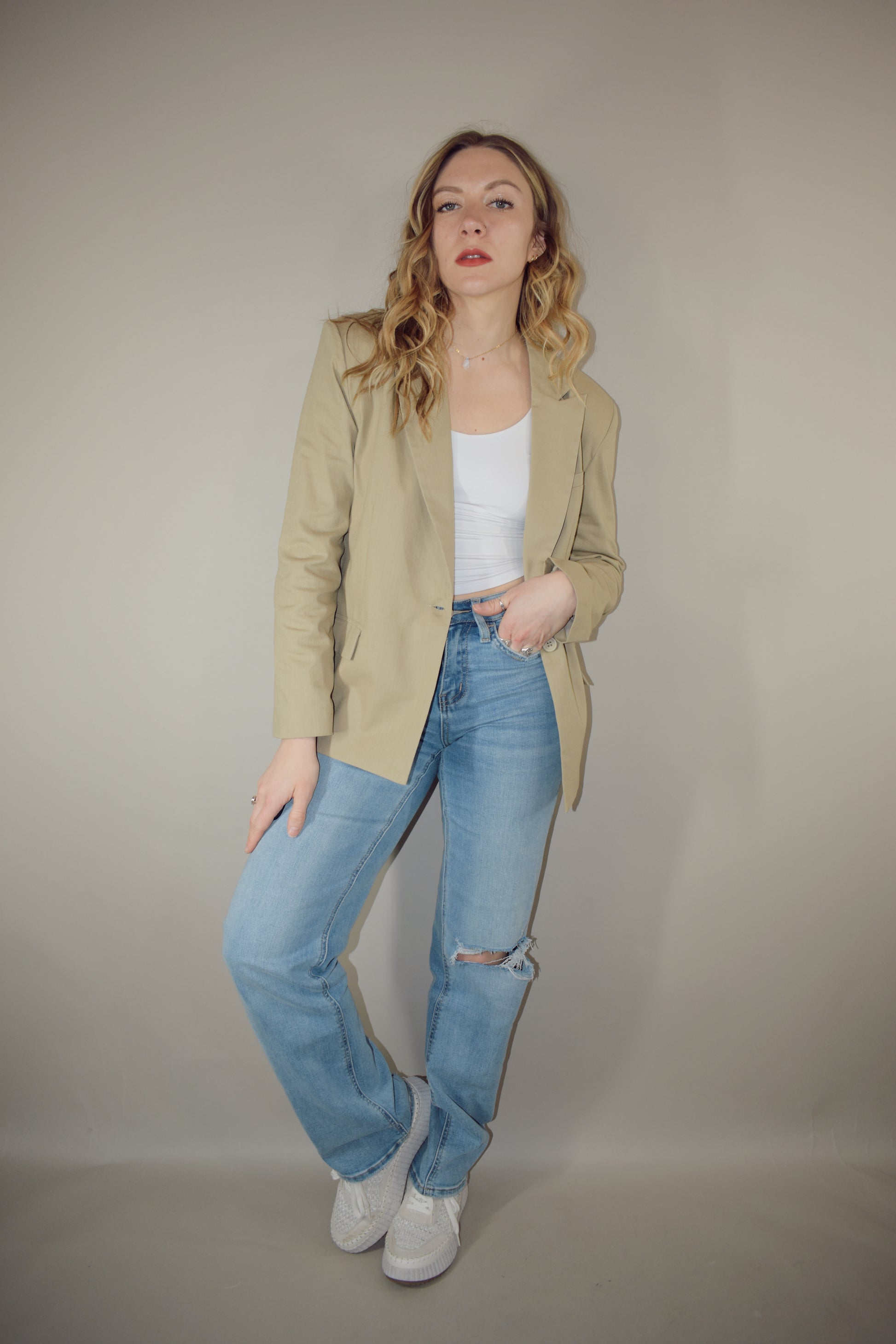 nude linen blazer full length front pockets with flap enclosure single button enclosure slit in back hemline relaxed shoulder pad structure