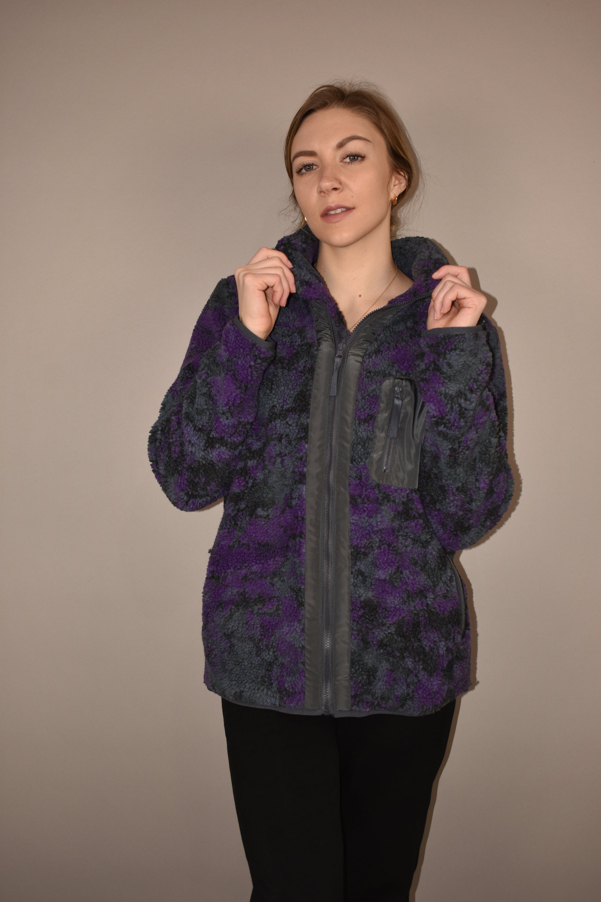 purple, black and gray tie dye full front zip sherpa jacket with one zip breast pocket and side pockets. zips up to a turtleneck and full length.
