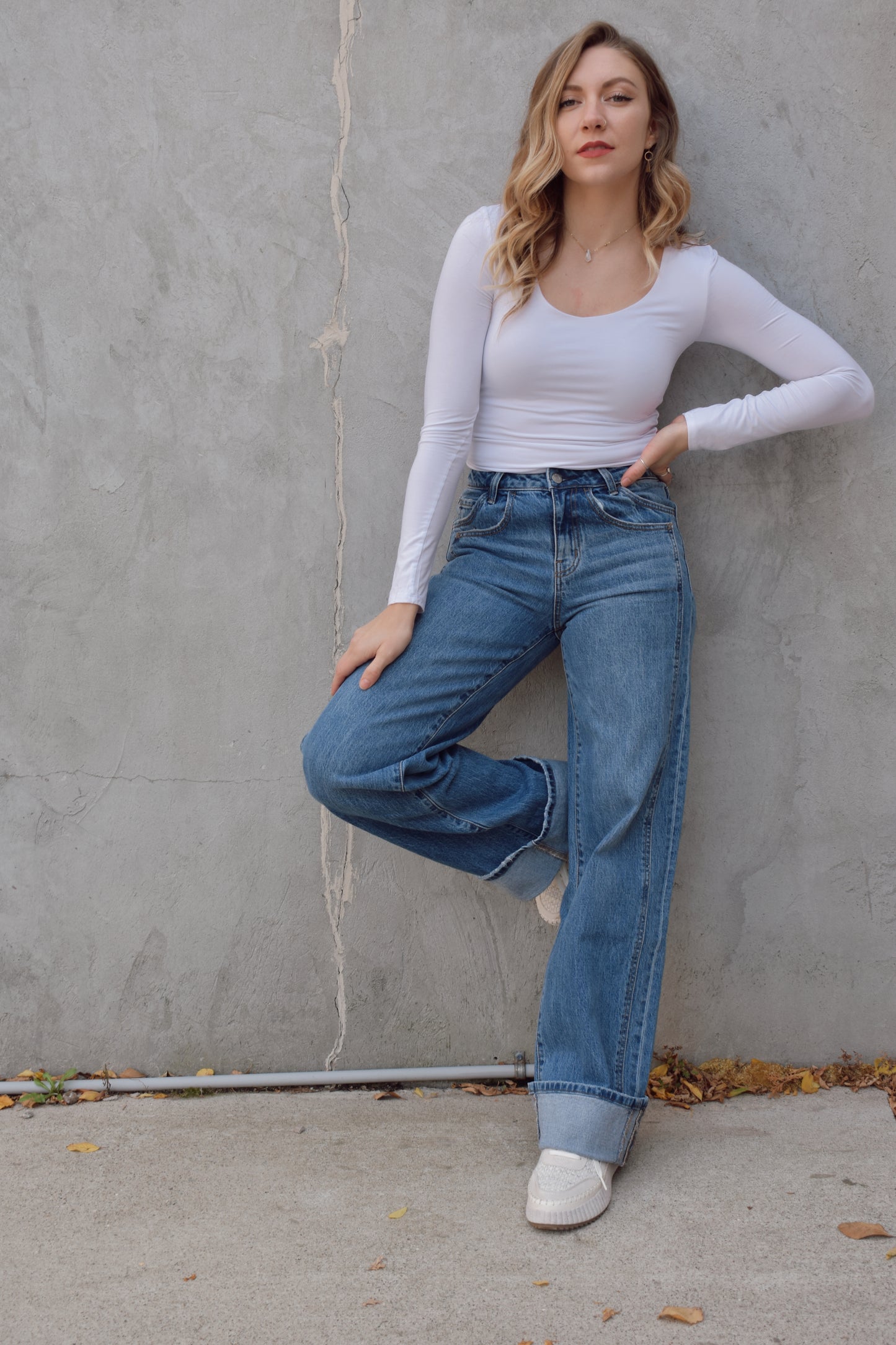 Long wide leg double panel double front pocket jeans with wide cuff at hem that is able to be uncuffed too. no distressing or holes, waistband is a little more rigid but denim is stretchy. zip and button enclosure, has beltloops 