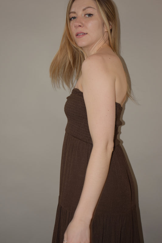 strapless maxi dress with smocked fitted bodice with tiered skirt flowy and has a ruched detail on front of bodice 