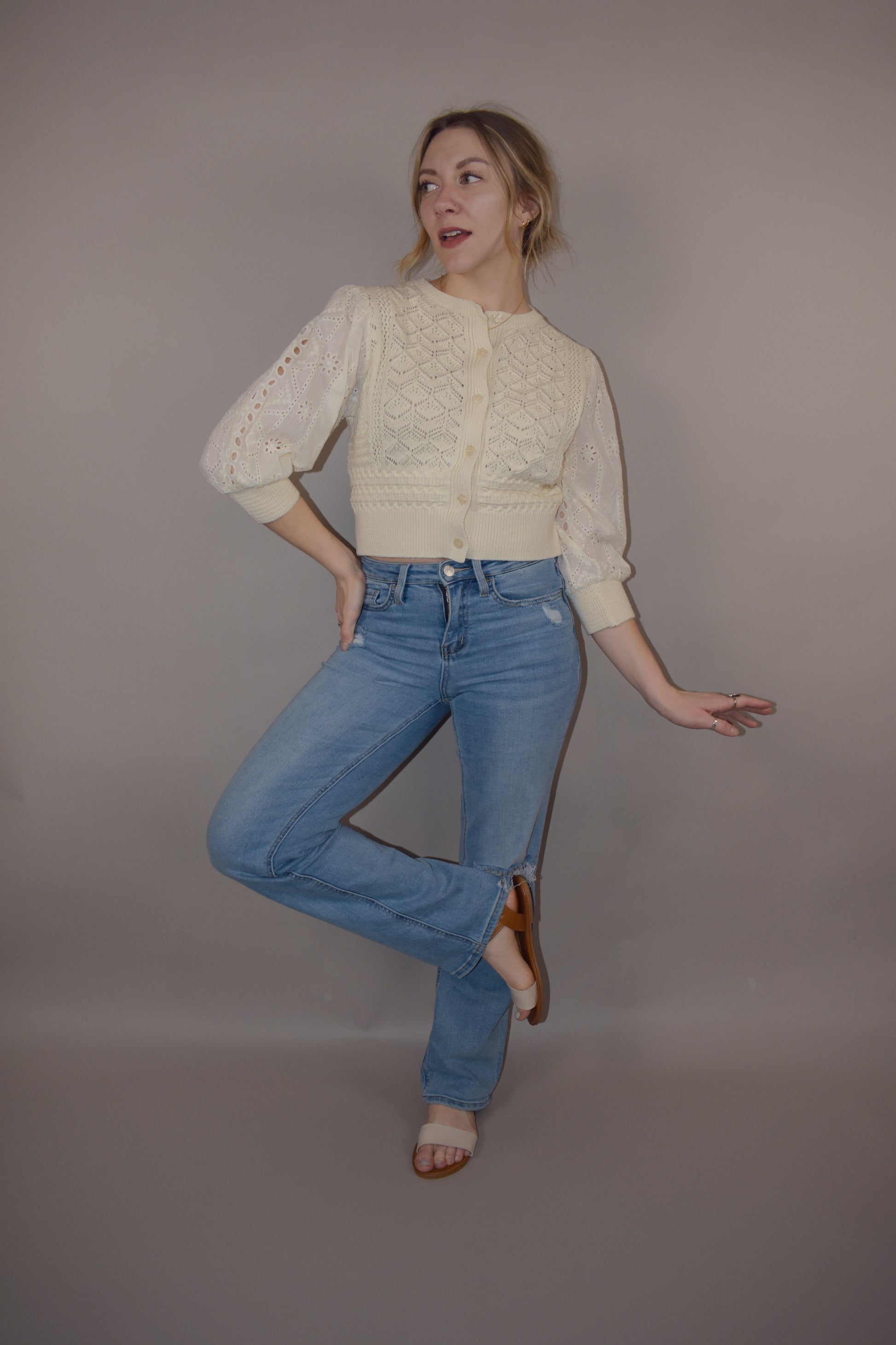 cropped button down top, round neck, 3/4 sleeves, crochet stitching on bodice, lace sleeves, knit cuffs and hem. super charming and unique
