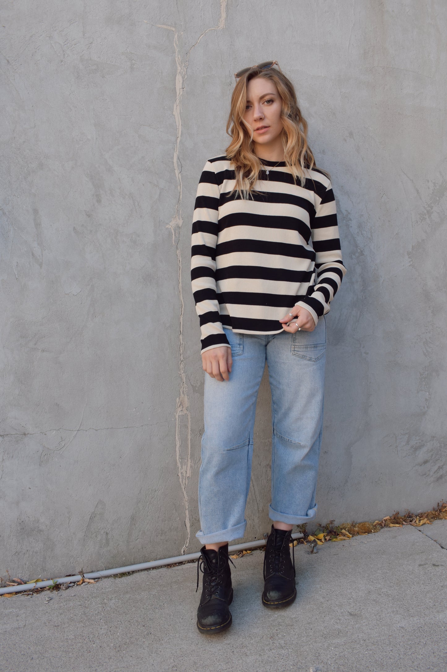 long sleeve full length black and beige striped crew neck. stripes are wide and horizontal. relaxed fit