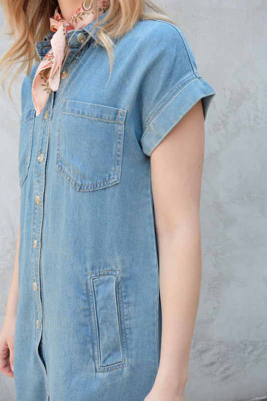 short sleeve button down denim colored medium wash mini dress straight fit has front pockets and patch breast pockets has collar and buttons down the whole front