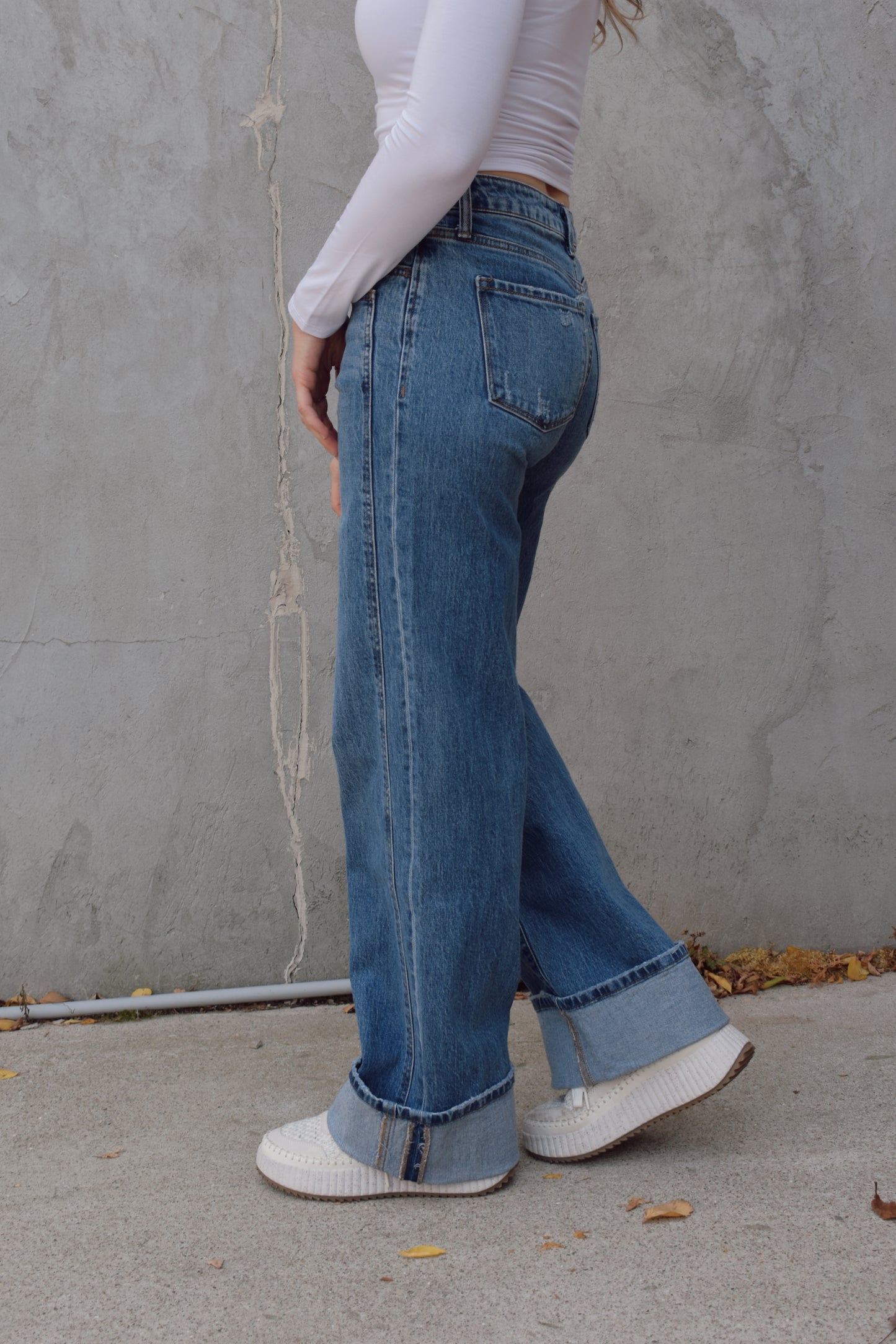 Long wide leg double panel double front pocket jeans with wide cuff at hem that is able to be uncuffed too. no distressing or holes, waistband is a little more rigid but denim is stretchy. zip and button enclosure, has beltloops 