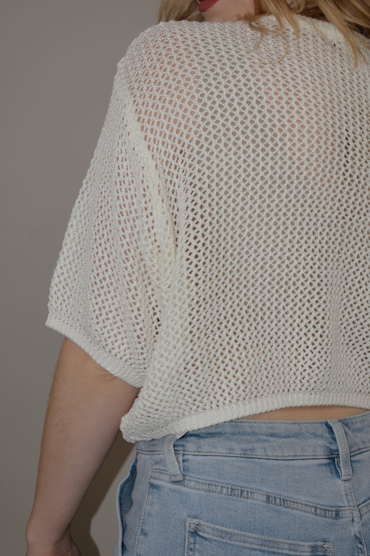 breezy cropped drop shoulder longer short sleeve crocheted shirt with buttons down the front and a crew neck style loose fitting perfect for warm weather